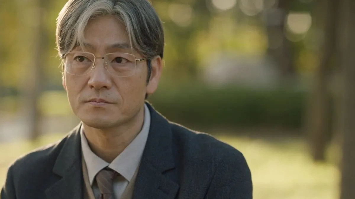 Kang Ju contemplating the events leading to the murders
